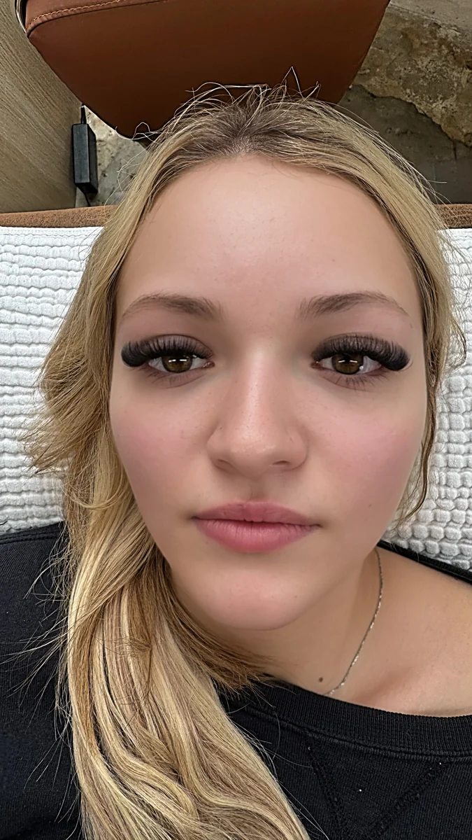 Client portrait showing fluffy lashes and a dark lash line